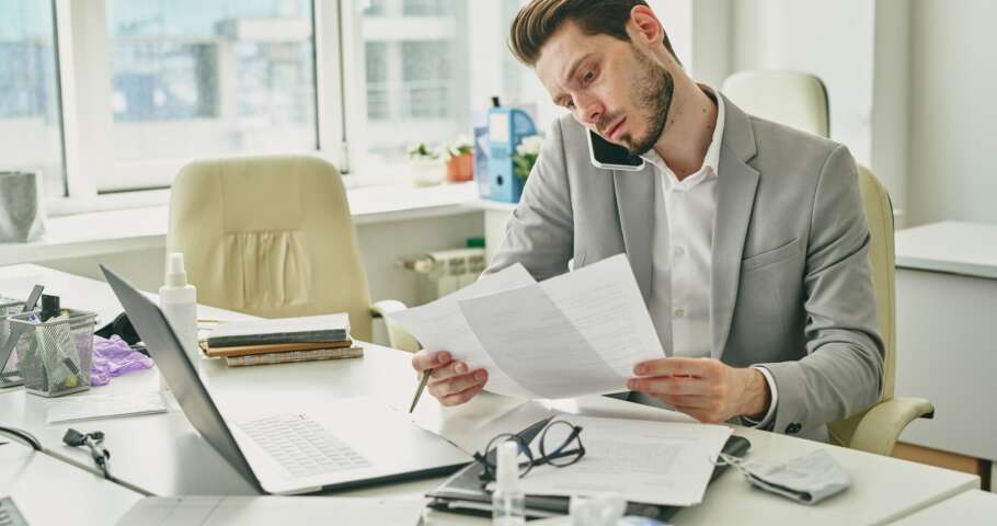 Businessman solving work issues by phone