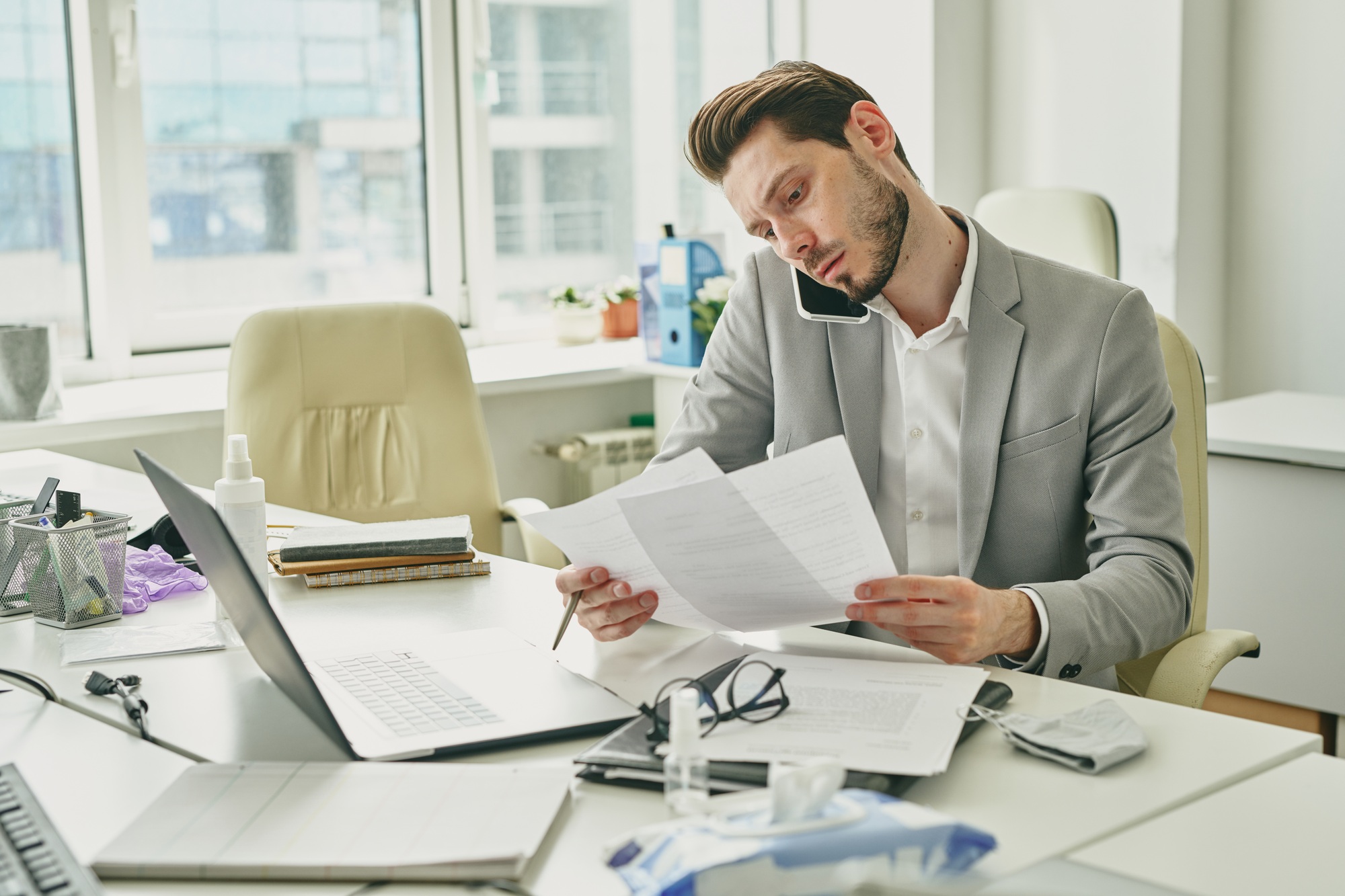 Businessman solving work issues by phone